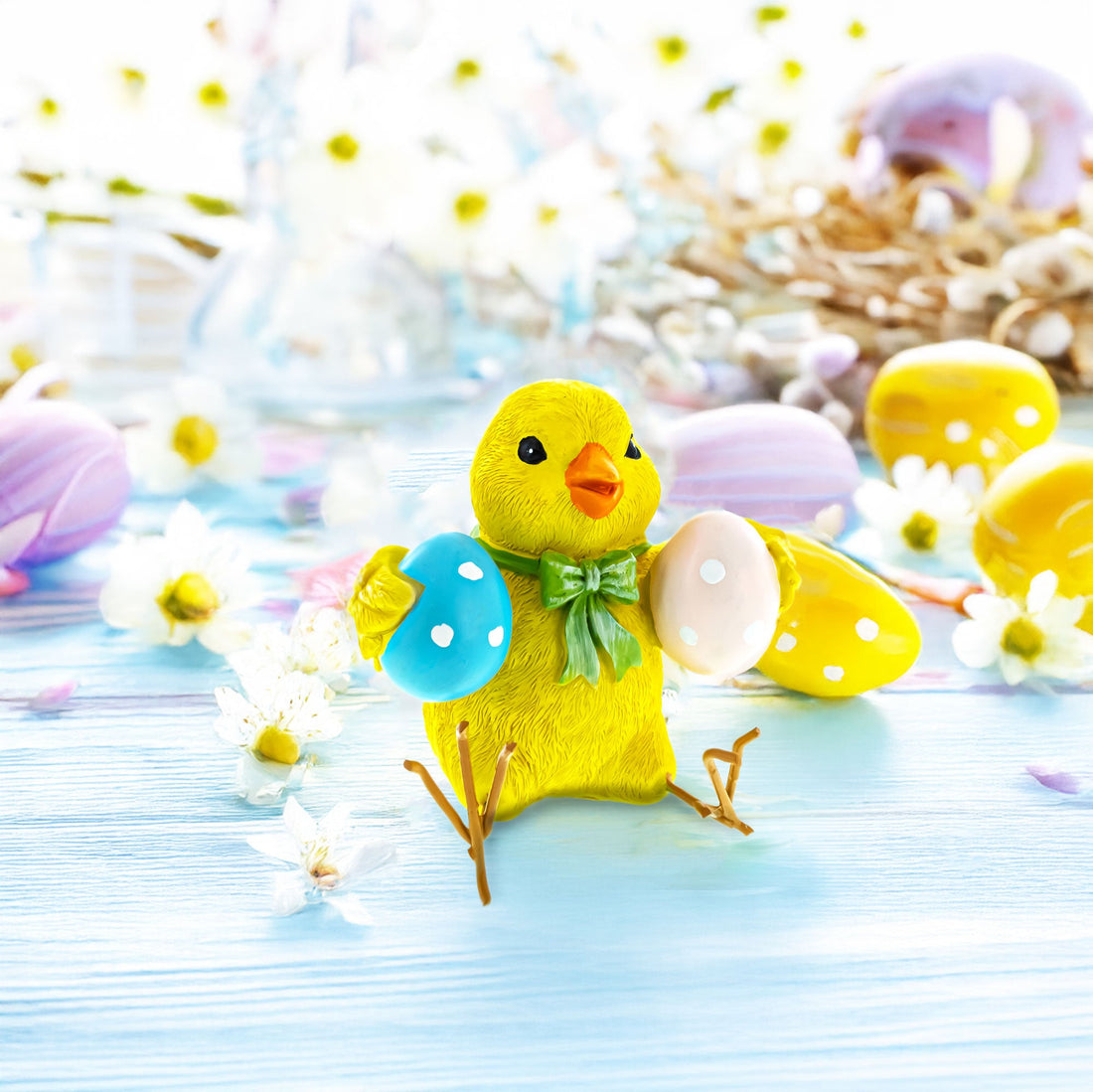 Cheerful Chick Clutching Colorful Easter Eggs Figurine